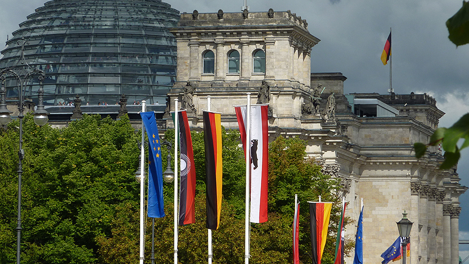 Flags in banner format with the Reichstag building in the background